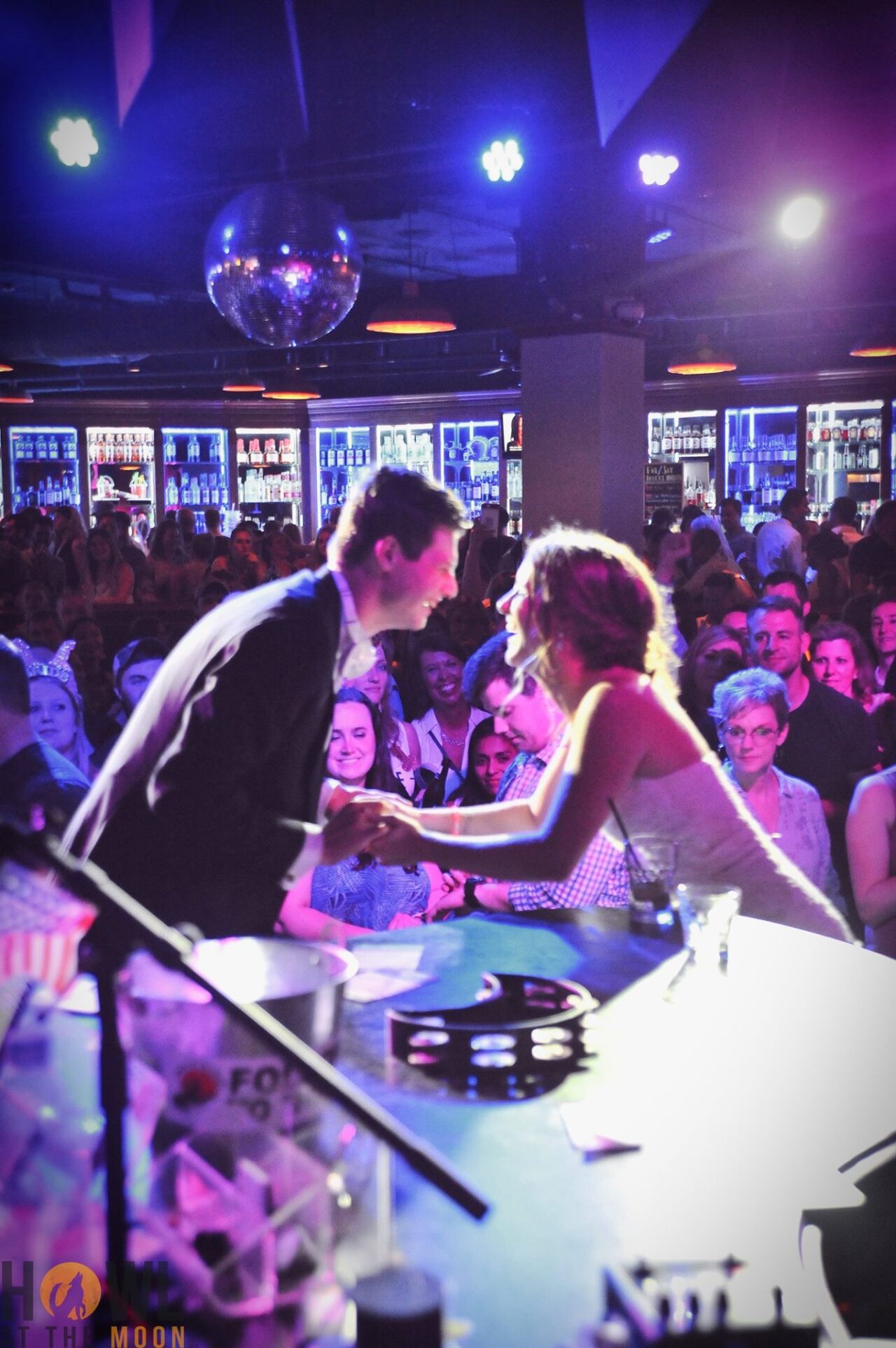 Newly weds dancing on stage together