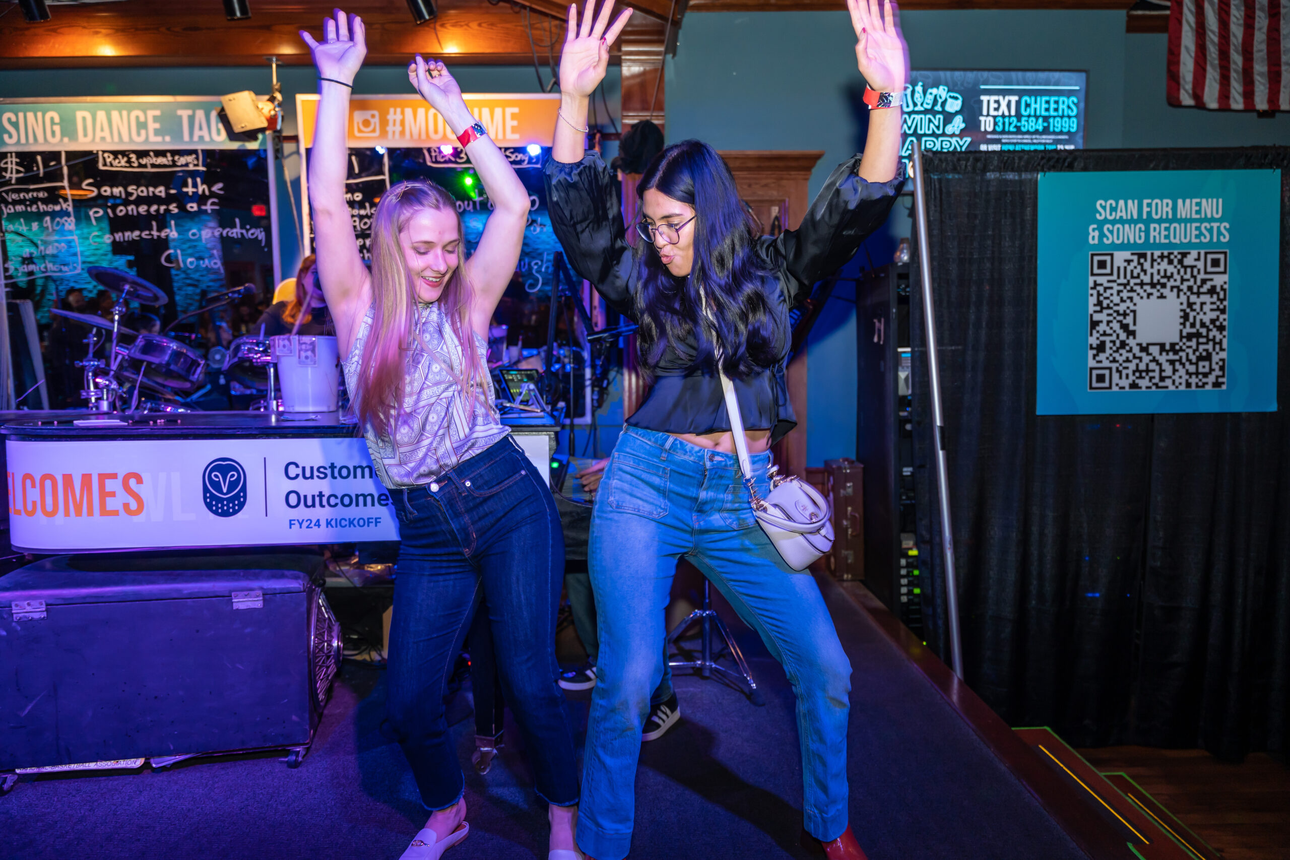two women dancing on stage