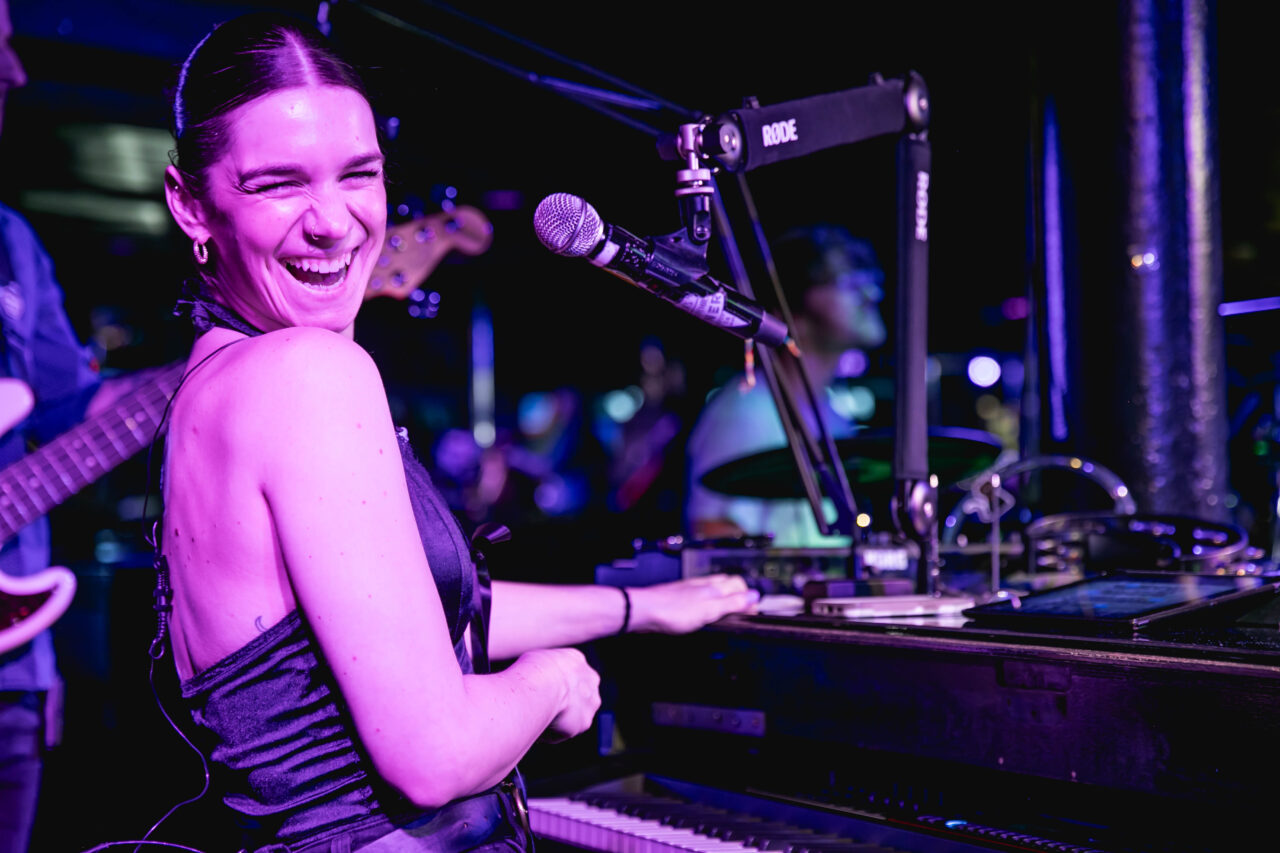 Female performer at corporate party on stage