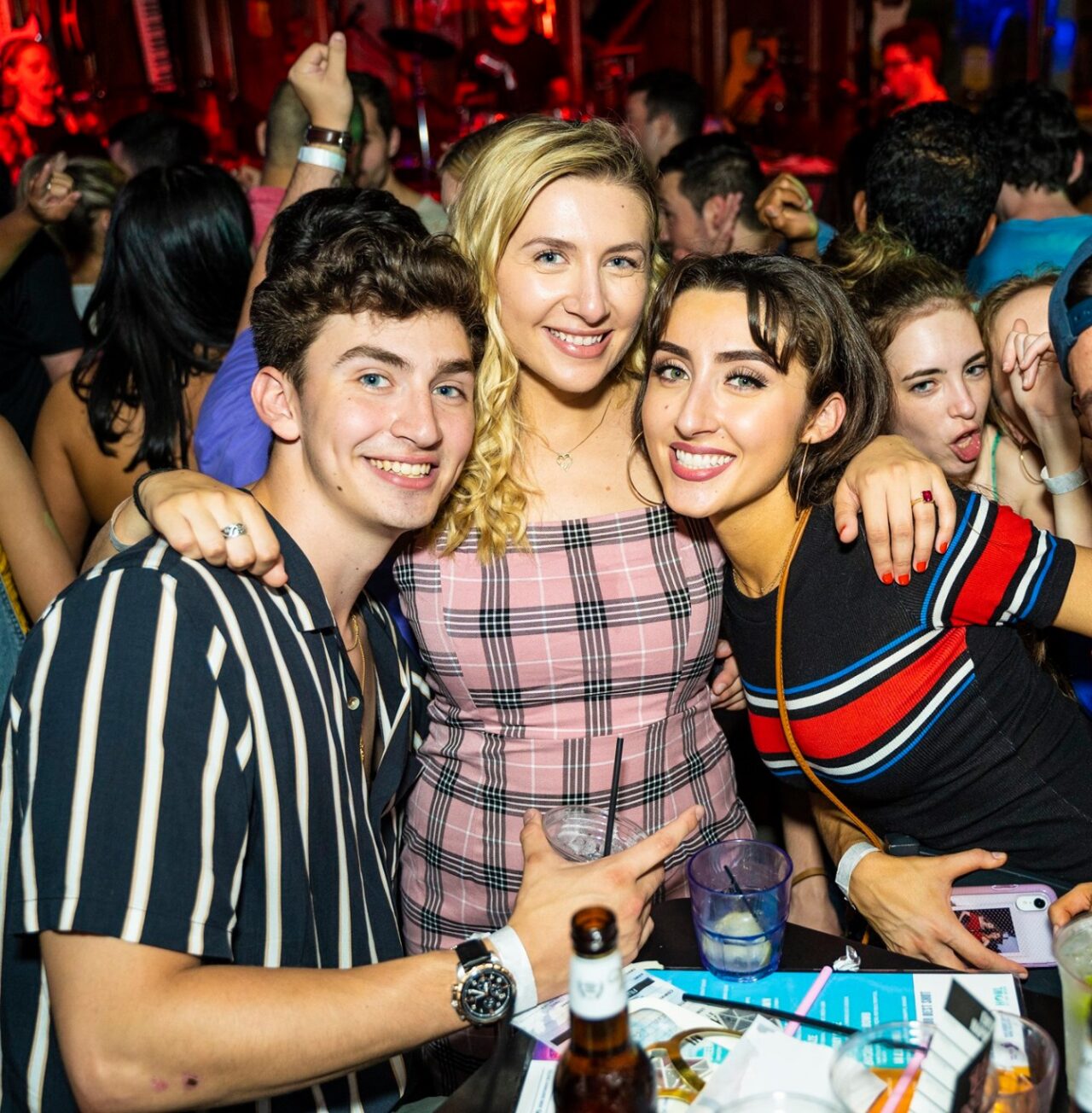 three friends partying at their table reservation