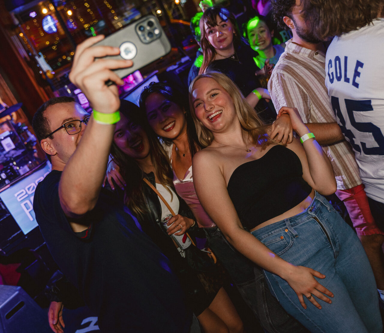 Friends taking a selfie together during Happy Hour at Howl at the Moon.