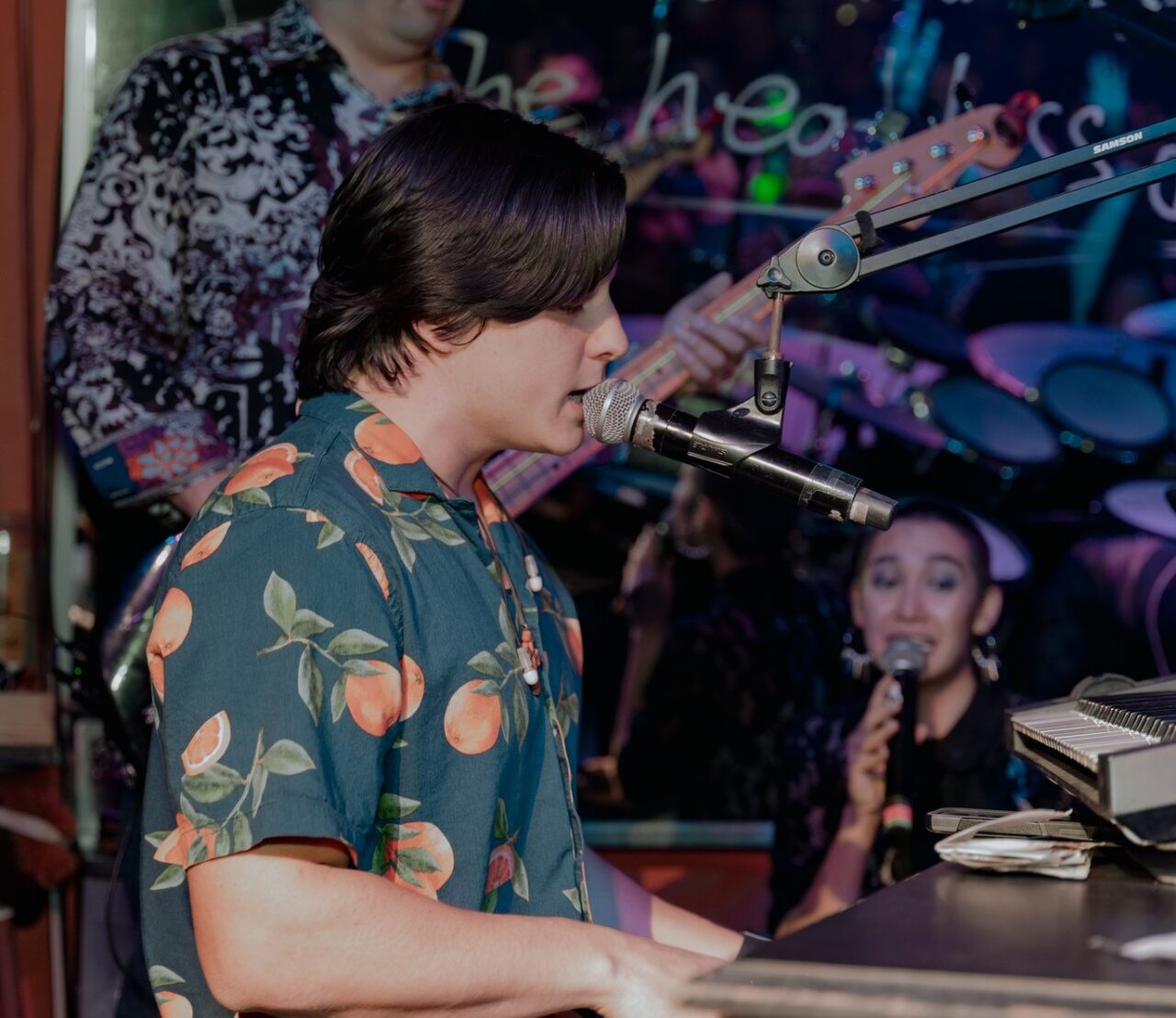 Musician performing live on stage during San Antonio Happy Hour at Howl at the Moon.