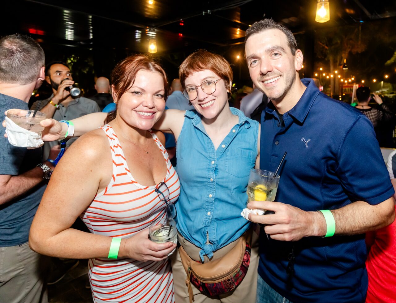 Friends enjoying drinks together during Orlando Happy Hour at Howl at the Moon.