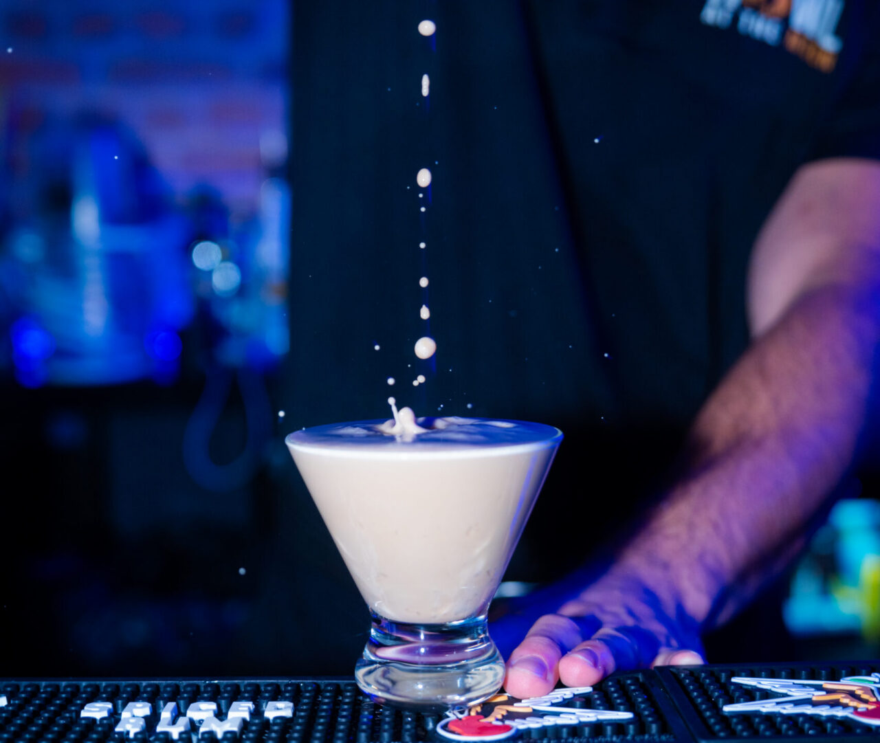 Signature cocktail being prepared during Kansas City Happy Hour at Howl at the Moon.