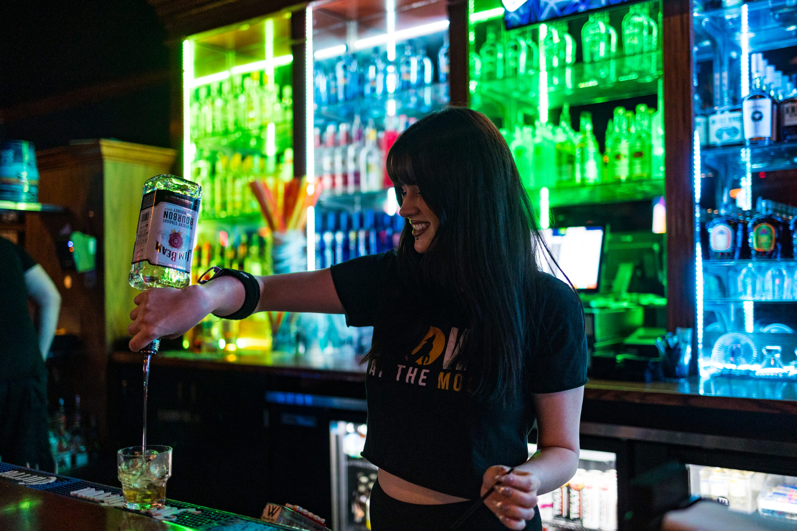 Bartender making cocktails during Kansas City Happy Hour at Howl at the Moon.